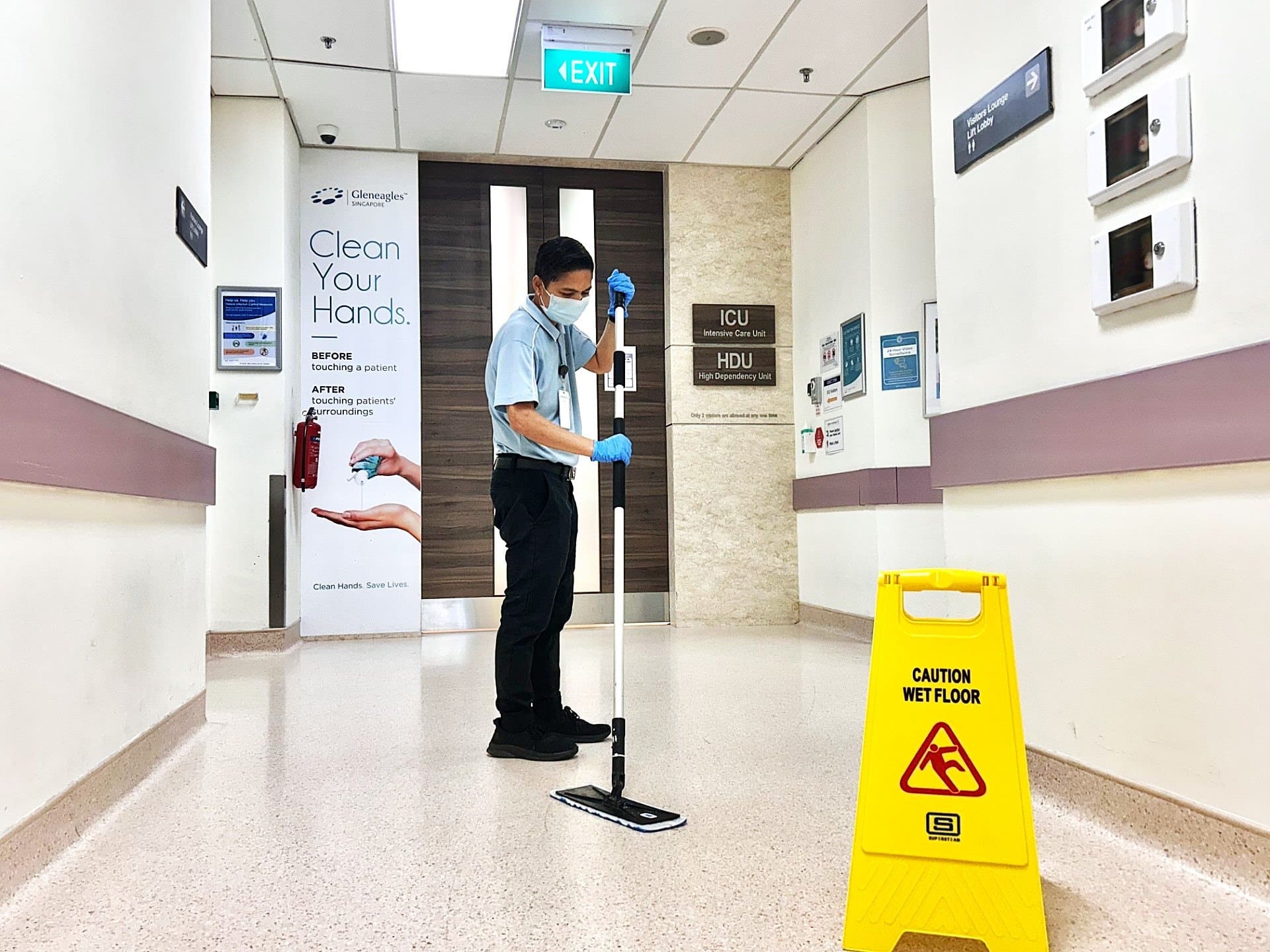 Healthcare Cleaning - Man mopping hospital floor